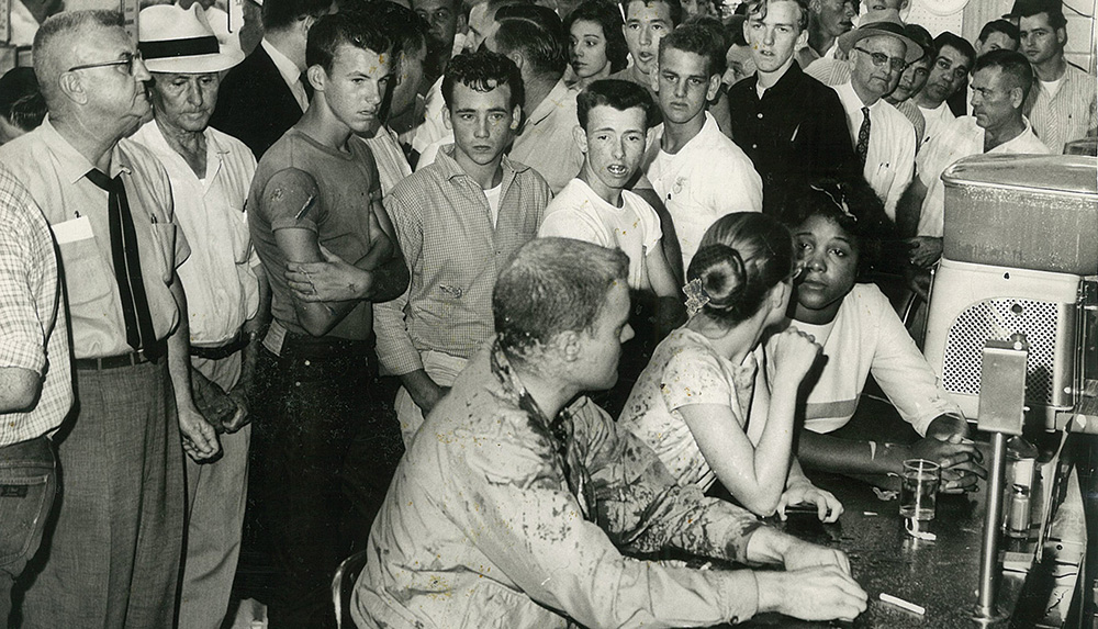 Students from Tougaloo College stage a sit-in at the Woolworth's lunch counter in downtown Jackson, MS, in May 1963