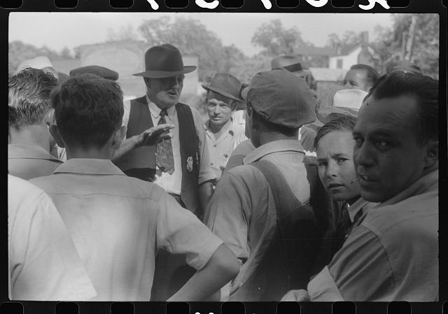 Chief of police talking to CIO pickets outside a mill in Greensboro, Greene County, Georgia