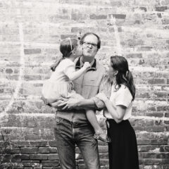 black and white photo of Peter Askew with his wife and daughter