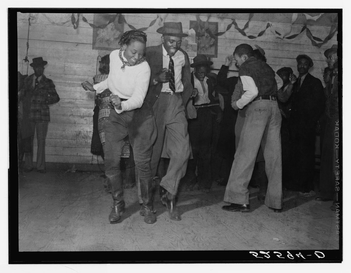 Jitterbugging in a juke joint on a Saturday evening, outside Clarksdale, Mississippi, 1939.